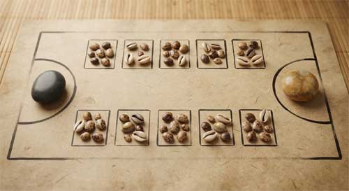Tablero de O An Quan dibujado en tierra con piedras y conchas dispuestas en sus hoyos rectangulares